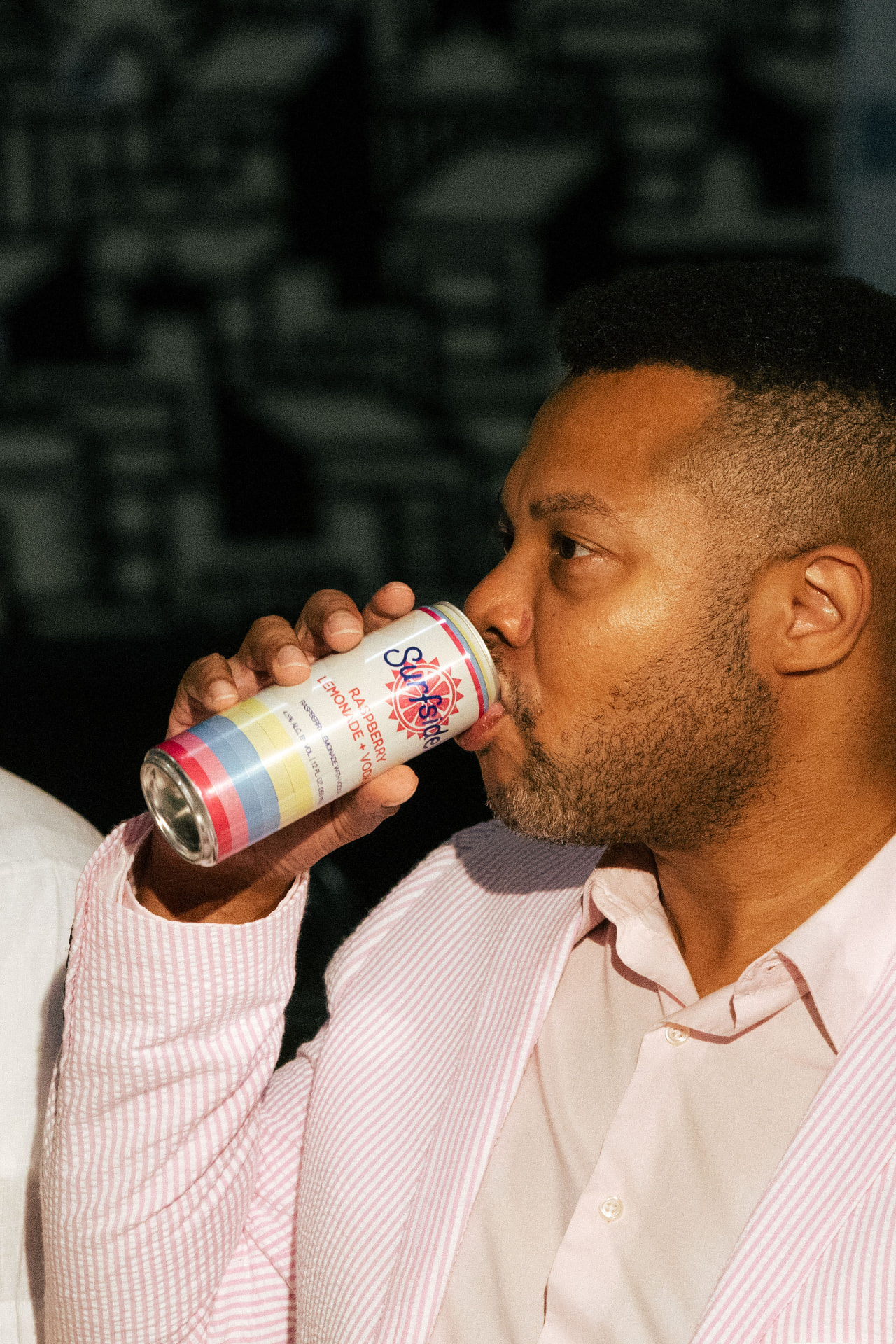 Attendee enjoying a drink during the cocktail hour